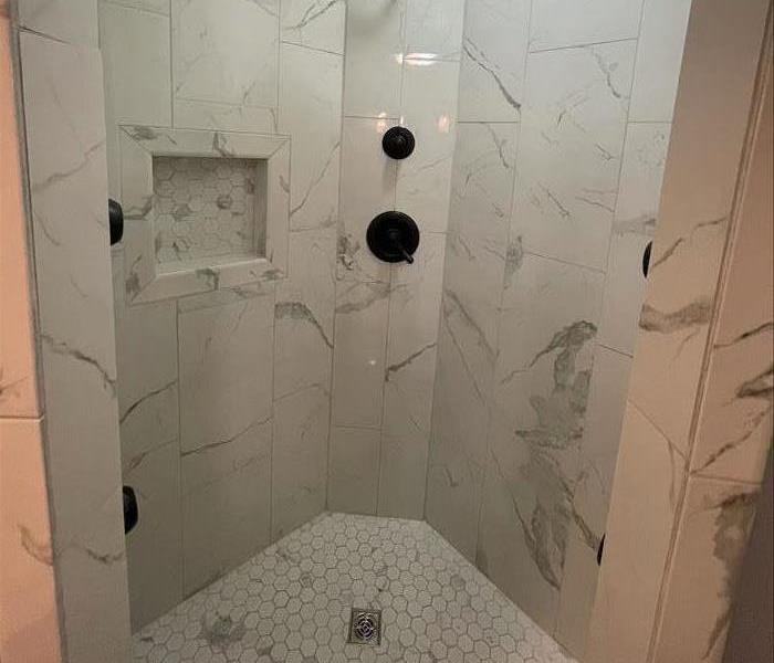 This picture shows the same shower with major upgrades after the job was complete.