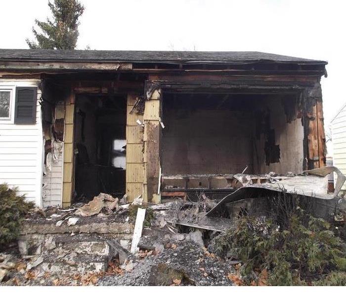 The first image shows the front of a home after is was destroyed in a fire.