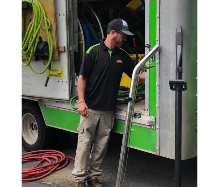 SERVPRO water tech demonstrating how to use the SERVPRO water vehicle.